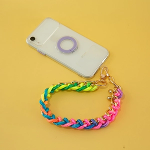 Colorful woven phone strap with gold chain and metal lobster clasp on yellow background