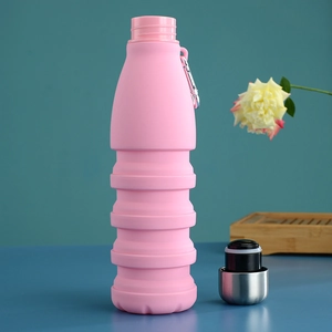 Pink collapsible silicone water bottle with metal cap and carabiner for outdoor sports