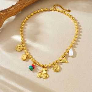 Vintage gold-plated necklace with skull cherry, eye pendants and colorful crushed stones