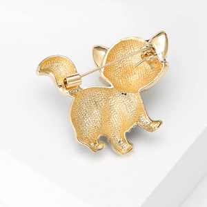 Golden cat metal brooch back view with fine texture on a white geometric stand