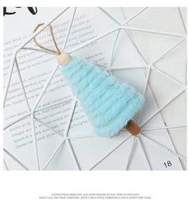 Detailed view of light blue plush Christmas tree ornament with wooden beads and jute rope