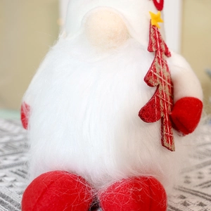 Detailed close-up of Christmas gnome featuring a long white plush beard and plaid tree decor