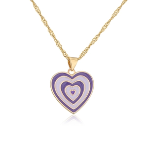 Macro detail of 18K gold-plated necklace featuring purple enamel layered heart pendant