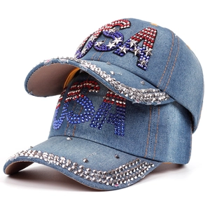 Washed blue denim baseball cap featuring patriotic USA rhinestone letters and silver studs
