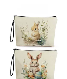 Detail showing two canvas cosmetic bags with vintage watercolor Easter bunny prints