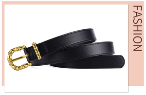 Close-up of fashion black PU leather belt with a vintage gold bamboo style buckle