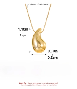 Macro shot showing dimensions of gold teardrop necklace with 48cm chain and CCB pendant