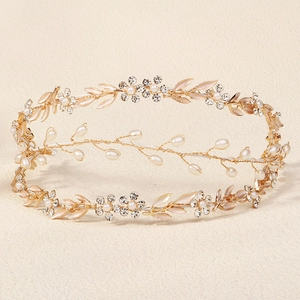 Detailed macro view of baroque gold leaf bridal headband with pearls and rhinestones