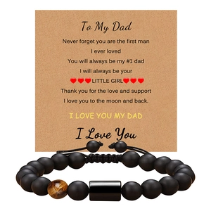 Detail of matte black beads and tiger eye stone bracelet on 'To My Dad' message card