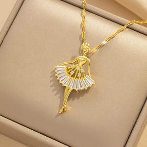 Elegant gold ballerina pendant necklace with white zircon crystals in a luxury gift box