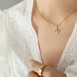 Gold plated titanium steel necklace with letter N pendant and inlaid cubic zirconia crystals