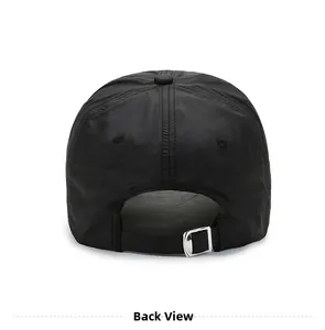 Detail view of the black quick-dry baseball cap featuring an adjustable metal buckle