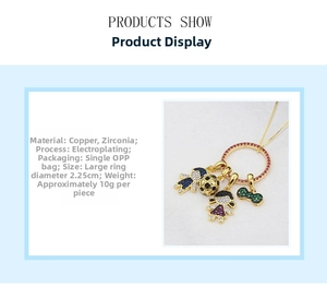 Detail view of gold-plated copper pendant with colorful cubic zirconia charms
