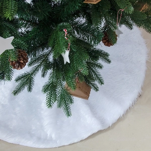 White faux fur Christmas tree skirt with plush long hair texture for holiday home decor