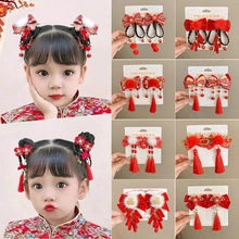Detailed views of traditional Chinese red hairpins with tassels and Fu embroidery for kids