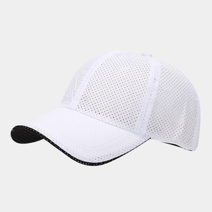 Close-up of white mesh baseball cap showing breathable holes and durable fabric texture