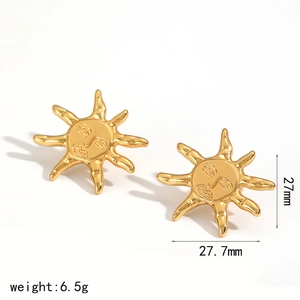 Detailed size view of gold sun-shaped earrings with embossed abstract face design