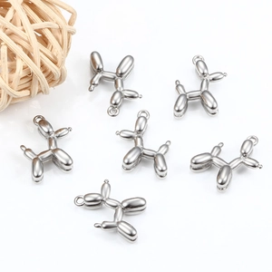 Set of six silver stainless steel balloon dog pendants on white background