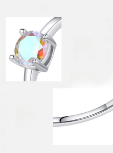 Detailed macro view of S925 sterling silver ring showing colorful zircon and 4-prong setting