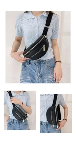 Détail du sac banane en cuir grainé noir avec fermeture éclair dorée et sangle large