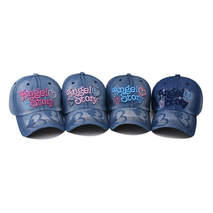 Set of four washed denim baseball caps with heart embroidery in light to dark blue shades
