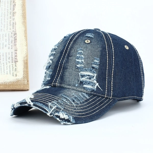 Vintage distressed denim baseball cap with frayed holes and yellow stitching detail