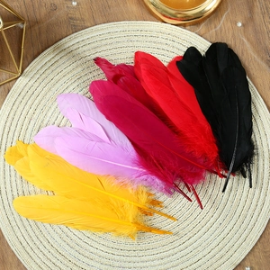 Colorful natural goose feathers in yellow, pink, and red for DIY dream catcher crafts