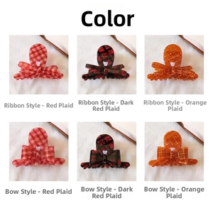 Detail view of plaid acetate hair claws in red and orange colors with ribbon bow designs
