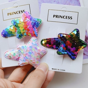 Close-up of glitter star hair clips set for girls featuring colorful sequins and metal clips