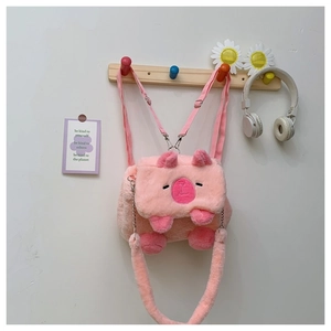Detailed view of a cute pink plush capybara bag featuring a metal chain strap and soft fur