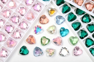 Detailed view of colorful 12mm heart-shaped glass crystals for DIY jewelry and crafts