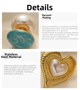 Detailed macro view of 18k gold plated stainless steel heart and marble stud earrings