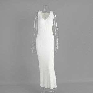 Detail view of white ribbed knit maxi dress showing deep V-neckline and slim fit texture