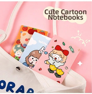 Close-up of three mini cartoon notebooks inside a canvas bag for student stationery use