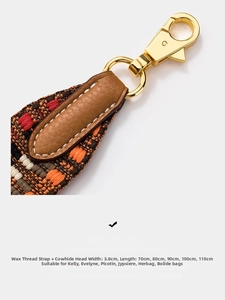 Macro shot of 3.8cm wide bohemian woven strap with leather ends and gold metal clips