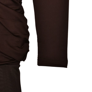Close-up of ruched side details and double stitching on brown bodycon dress fabric