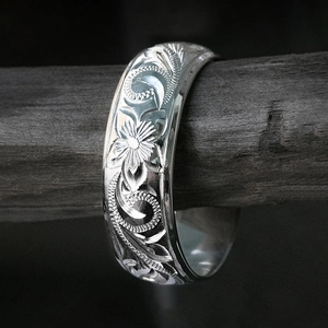 Classic silver ring with intricate floral scrollwork and vine engraving for daily wear