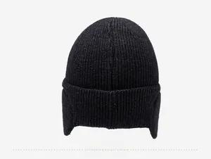 Rear view of winter thermal knit beanie with ear flaps and thick ribbed texture