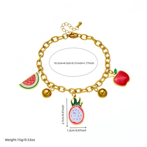 Gold fruit charm bracelet with colorful enamel pendants and size markings on white background