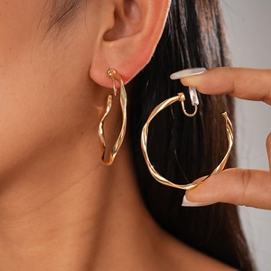Metallic geometric twisted hoop clip-on earrings for women in gold finish minimalist style