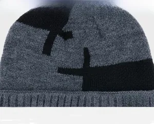 Detail of the gray knitted texture and yellow brand label on the thick winter beanie