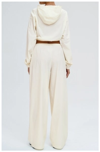 Rear view of cream-colored hooded sports set with relaxed fit pants for sun protection