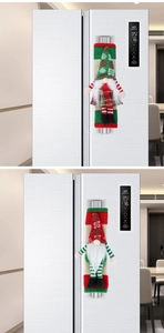 Detail of red and green Christmas gnome refrigerator handle covers on appliance