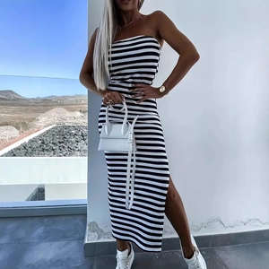 Detail view of the side slit on a striped strapless midi knit dress for women