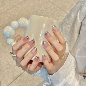 Pink cat eye press-on nails with silver French chrome finish on square-round shape