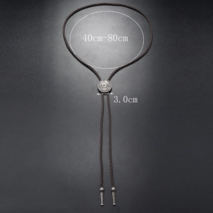 Detail showing adjustable brown braided leather strap and vintage silver bolo tie pendant