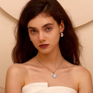 Silver vintage tarot square pendant necklace and chunky hoop earrings on model
