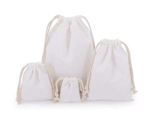 Set of four white canvas drawstring bags in various sizes with durable cotton cords
