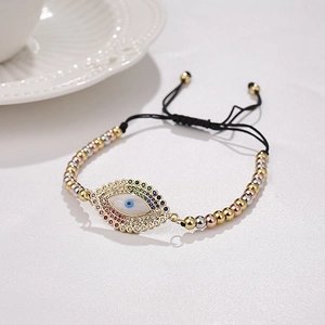 Bracciale Evil Eye con perle a tre toni oro argento e rosa con cordino intrecciato nero