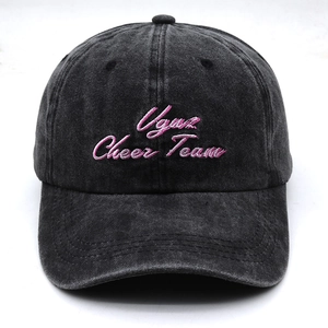 Detail of pink Vgus Cheer Team embroidery on a washed grey vintage baseball cap